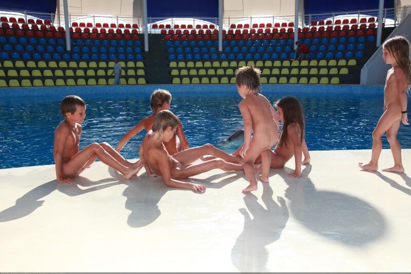 Swimming dolphins photo gallery - The desire to connect with nature and be unclothed