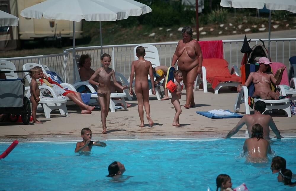 Naturist Afternoon Pool Games pics - Nudity in naturism is not usually an end in itself