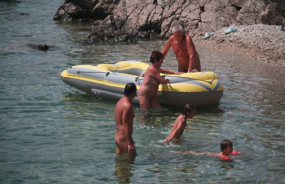 Lone Nudist in Yellow Boat photos - The idea of self-acceptance and self-respect is important among naturists