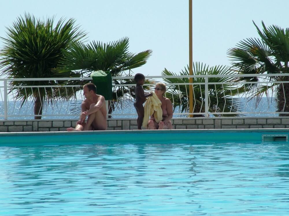 Photo of naturists in an outdoor pool - A well-known naturist center